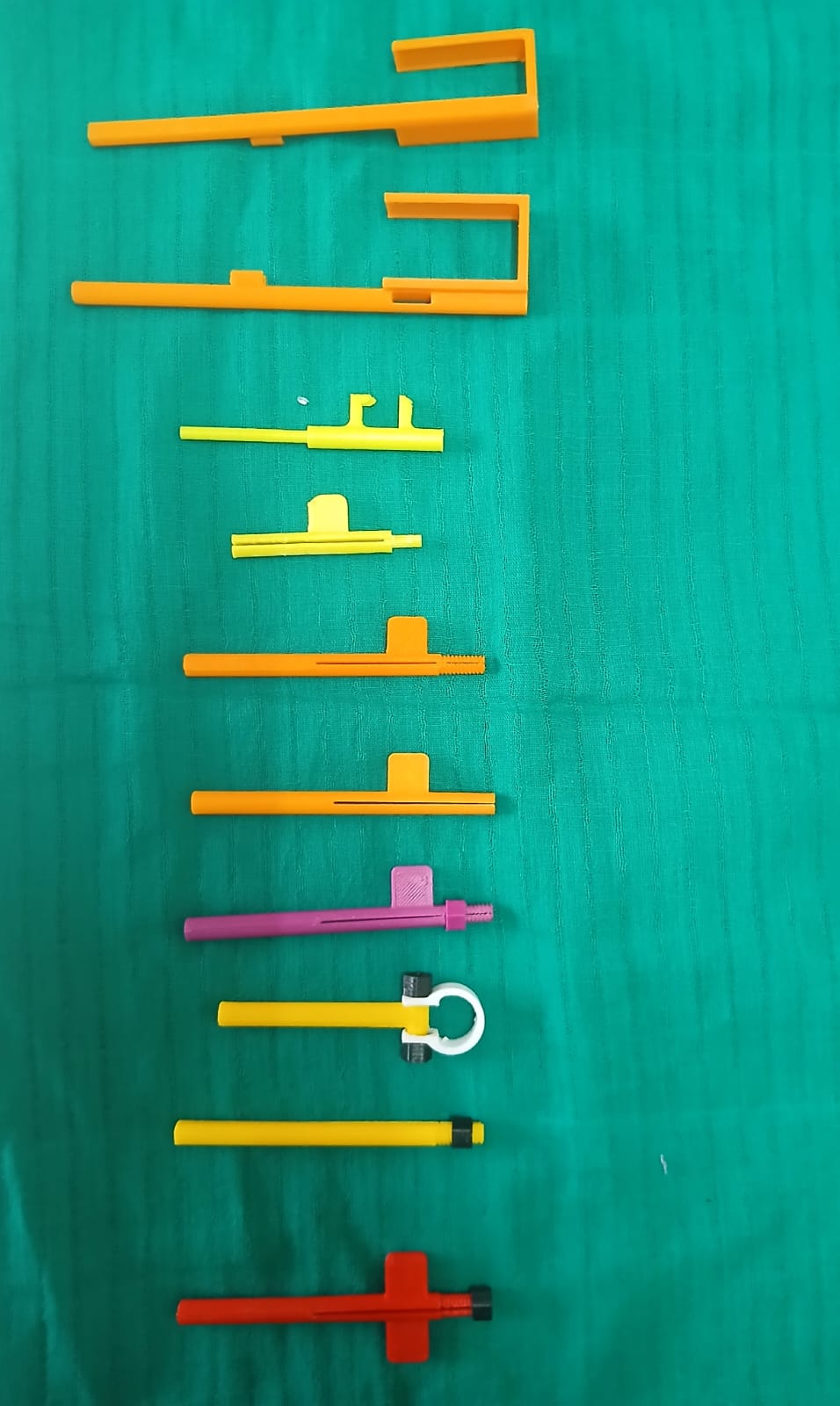 Successive prototypes of the KARVI holder, showing the iterative development process.