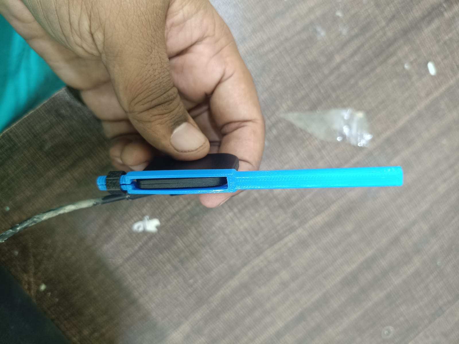 The blue KARVI holder, showing the open slot that takes a digital intraoral sensor.